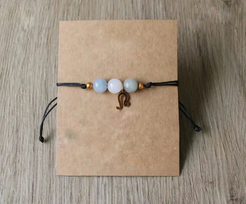 Byzylyk me miks gurësh natyralë dhe simbol të shenjave të zodiakut