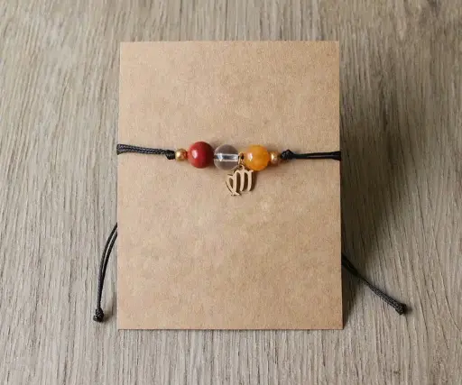 Byzylyk me miks gurësh natyralë dhe simbol të shenjave të zodiakut